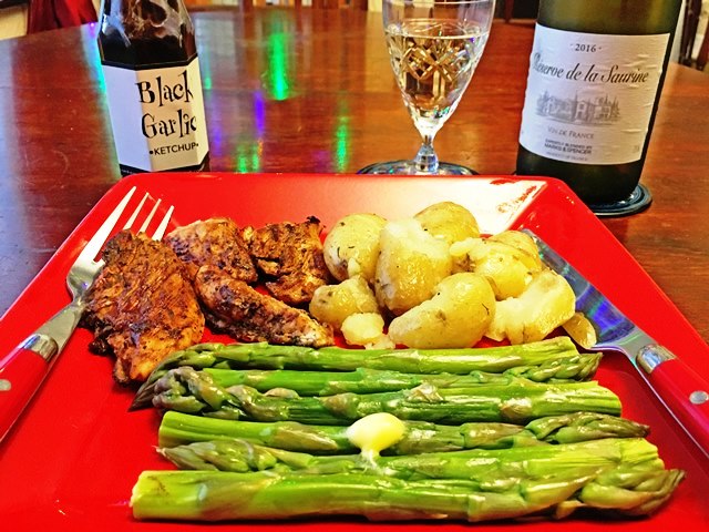 Jerk chicken, new potatoes, asparagus and Black Garlic Ketchup - photo zoe dawes