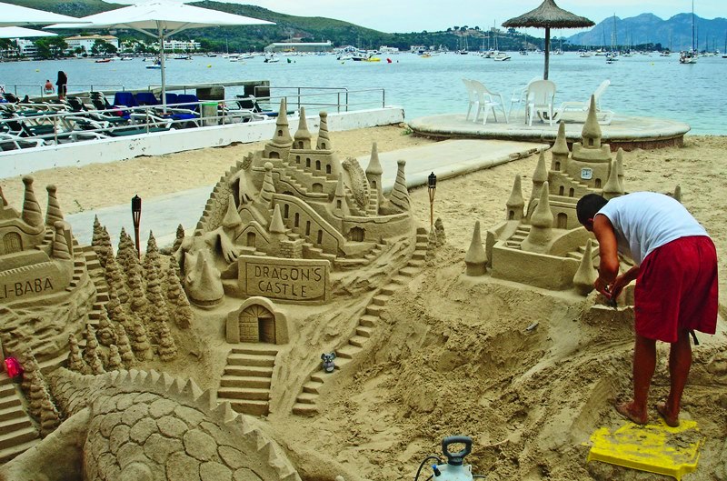 Building sandcastles on Puerto Pollensa beach Majorca