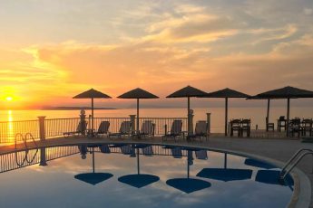 Sunset over pool at Aghios Stephanos Corfu - photo by Zoe Dawes
