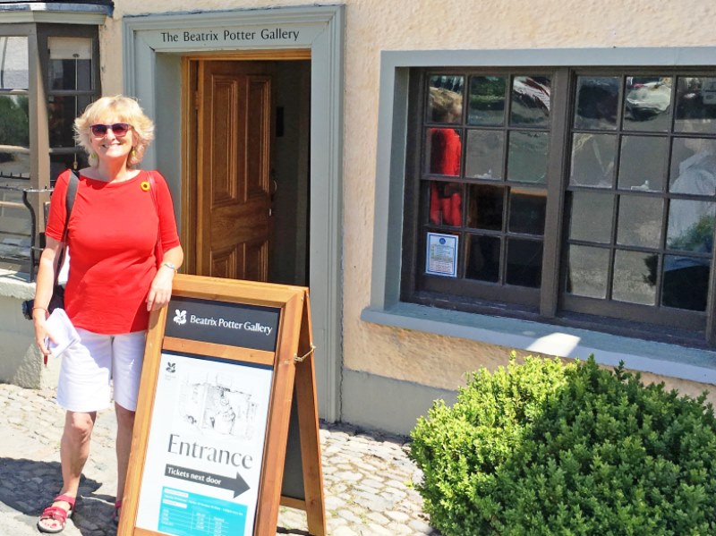 Zoe Dawes in front of Beatrix Potter Gallery Hawkshead